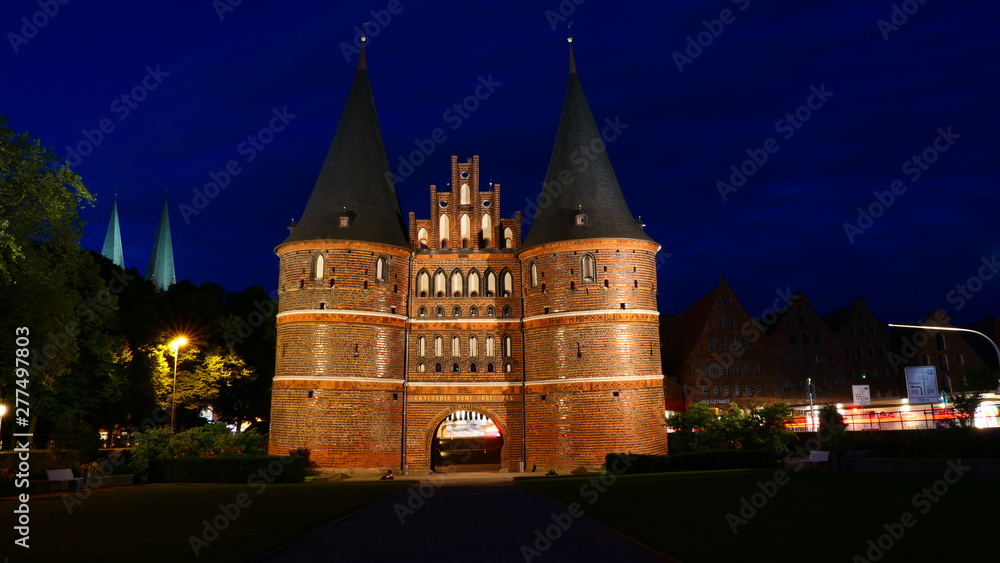 The famous Holsten Gate at night in Lubeck, Germany