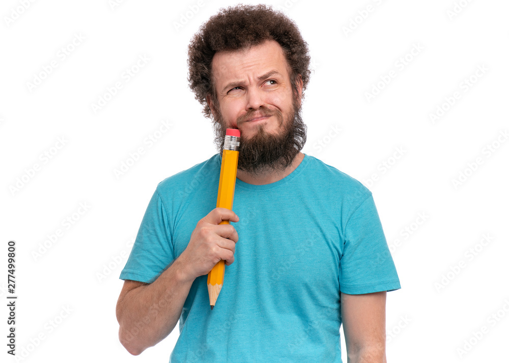 Crazy thoughtful bearded Man with funny Curly Hair holding Big Pencil - ponder and dreaming, isolated on white background. Crazy thoughtful bearded Man with funny Curly Hair holding Big Pencil - ponder and dreaming, isolated on white background.