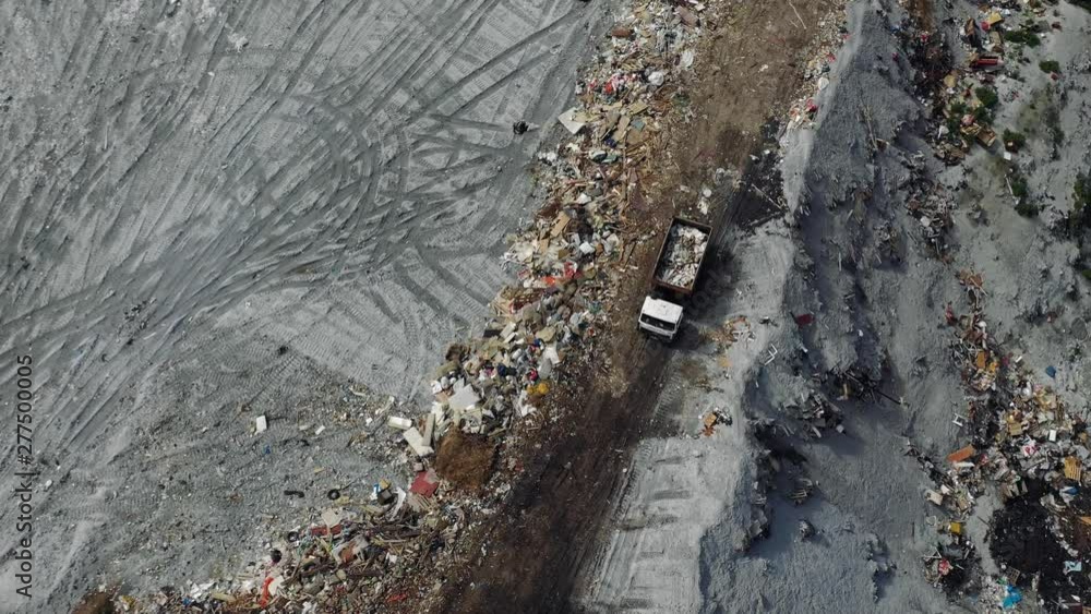 AERIAL. City dump or big garbage dump with trucks and bulldozers, top view, AERIAL. City dump or big garbage dump with trucks and bulldozers, top view,