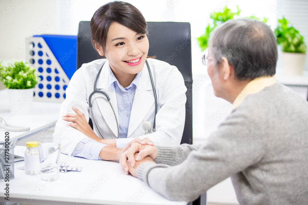 Female doctor see elder patient Female doctor see elder patient