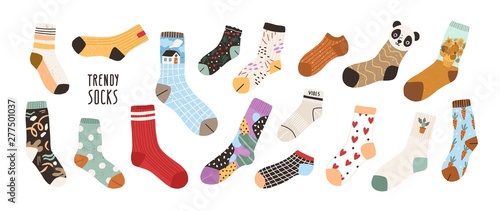 Collection of stylish cotton and woolen socks with different textures isolated on white background. Bundle of trendy clothing items. Modern garment or apparel set. Flat cartoon vector illustration. photo