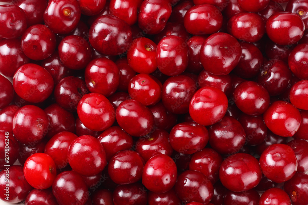 Red juicy cherries background. cherry texture. Top view. Red juicy cherries background. cherry texture. Top view.