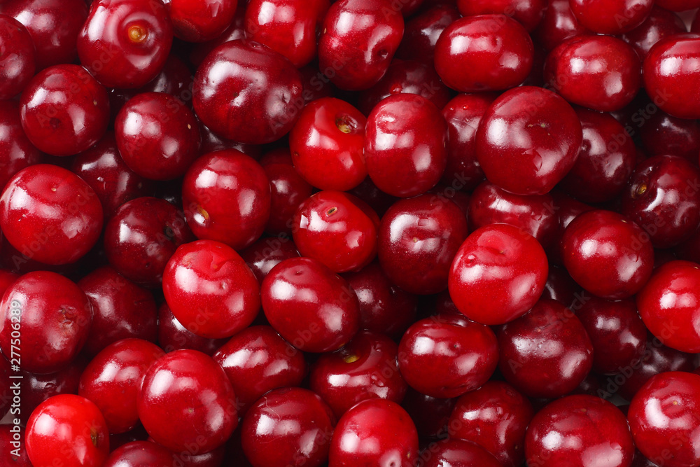 Red juicy cherries background. cherry texture. Top view. Red juicy cherries background. cherry texture. Top view.