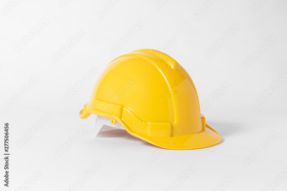 Yellow Plastic safety helmet for engineer on gray background. Yellow Plastic safety helmet for engineer on gray background.