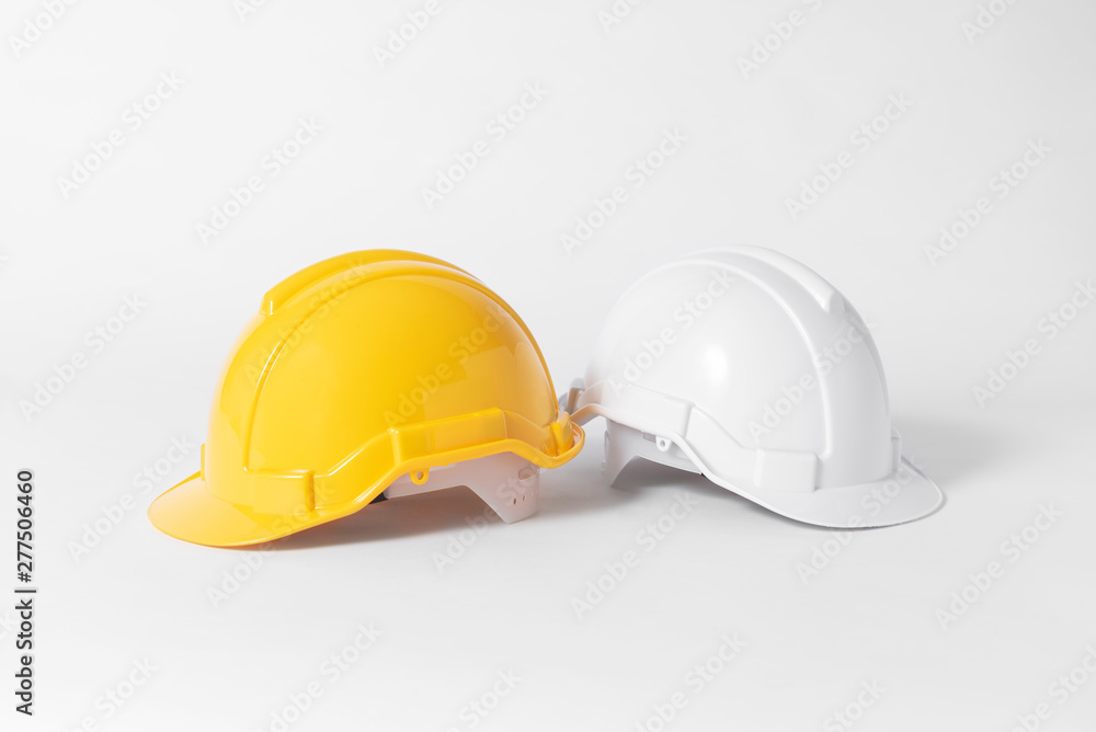 Plastic safety helmet for engineer on gray background. Plastic safety helmet for engineer on gray background.