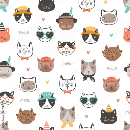 Seamless pattern with cute funny cat faces or heads wearing stylish accessories. Backdrop with cartoon animal muzzles on white background. Flat cartoon vector illustration for fabric print, wallpaper.
