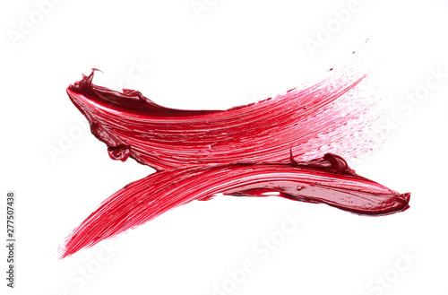 Smear and texture of red lipstick or acrylic paint isolated on white background.