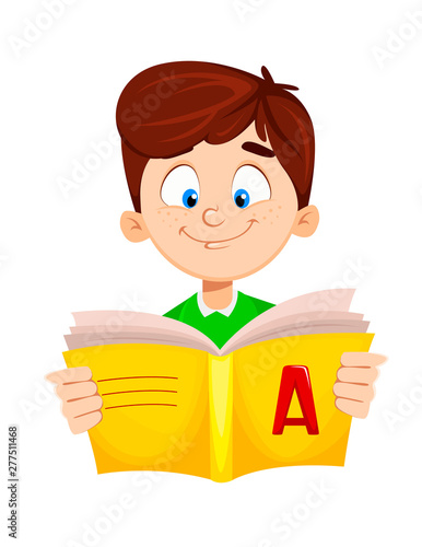 Back to school. Cute boy reading ABC book