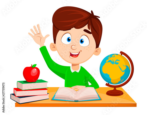 Back to school. Cute boy sitting at the table