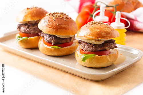 Food concept Homemade beefs hamburgers serve on square plate on white background with copy space