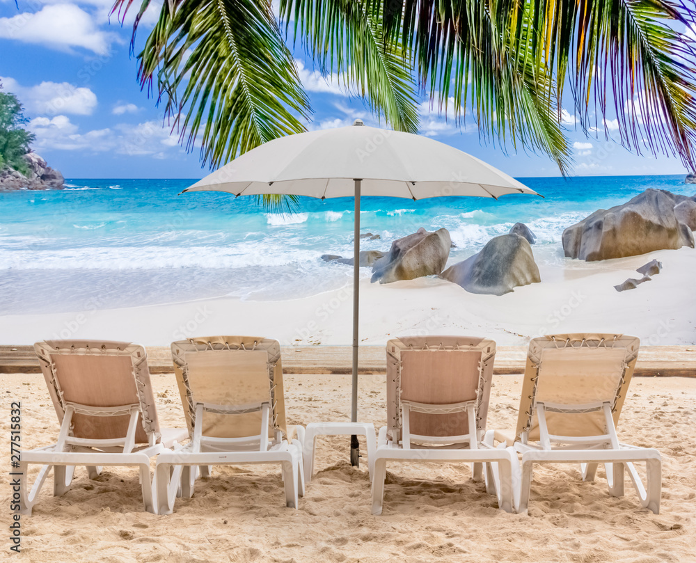 chairs and umbrella on tropical beach, Seychelles Islands