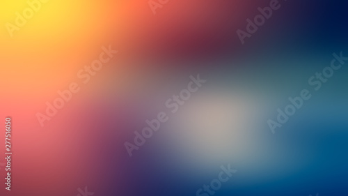 Red, yellow, blue and white gradient abstract blurred background of red, yellow, blue and white spots.