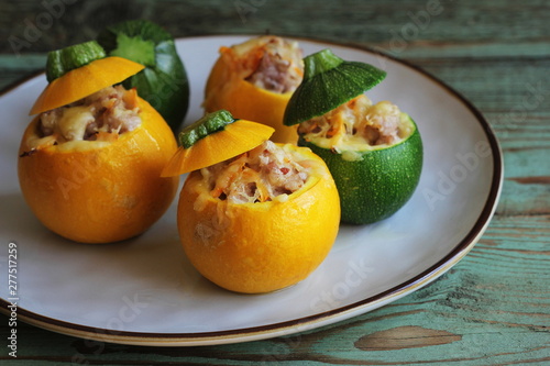 Baked round zucchini stuffed with minced meat, vegetables, and cheese