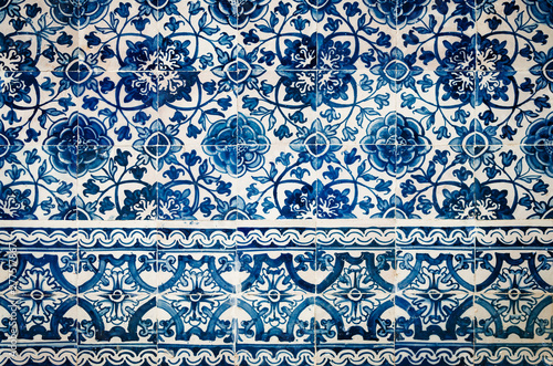 traditional portuguese azulejos, typical tin glazed white and blue ceramic tiles used to decorate walls, churches and palaces