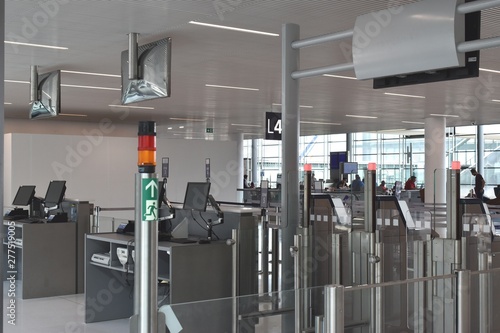 Picture of new equipment installed in main airports: the Automated Boarding Gate. It is the next step after the Online check-in and the Drop-Off luggages. Reduction of manpower/costs.