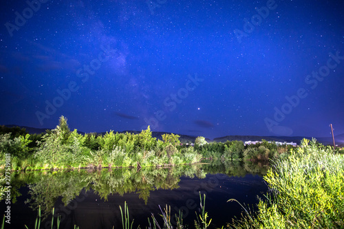 night landscape by the lake with stars