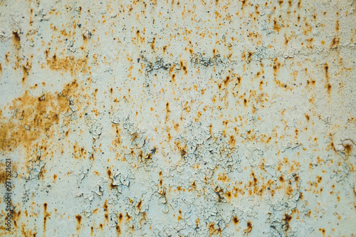Old corroded metal wall background with flaky gray paint .Rusty flaky cracked metal surface.Abstract the surface texture of the old metal.