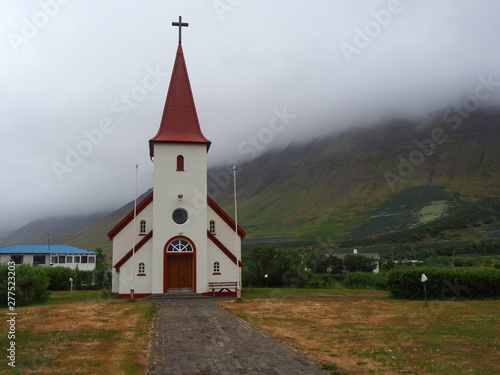 Church at Flateyri in the Westfjords of Iceland standing out against low cloud in the background