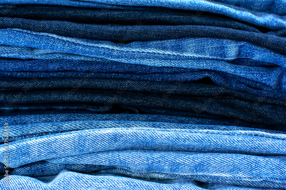Set of different blue jeans. Detail of nice blue jeans. Jeans texture or denim background. Blue denim jeans texture, fabric grunge background. Beauty and fashion, clothing concept Set of different blue jeans. Detail of nice blue jeans. Jeans texture or denim background. Blue denim jeans texture, fabric grunge background. Beauty and fashion, clothing concept
