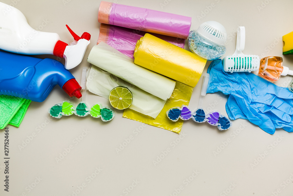 various detergents and the necessary attributes for cleaning, washing and ironing in the background. copy space various detergents and the necessary attributes for cleaning, washing and ironing in the background. copy space