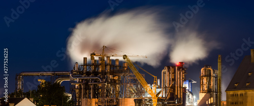 FACTORY AND NIGHT - Industrial infrastructure in the night environment photo