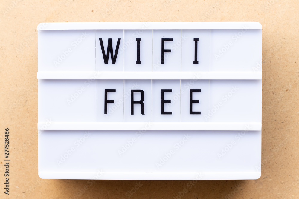 Lightbox with word wifi free on wood background Lightbox with word wifi free on wood background
