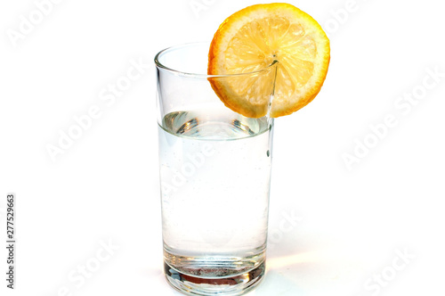 Glass of pure water with lemon isolated on a white background