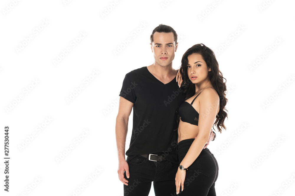 couple in black clothes embracing and looking at camera isolated on white couple in black clothes embracing and looking at camera isolated on white