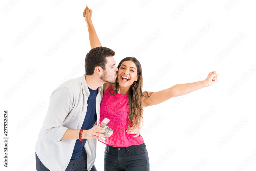 Cheerful Woman Accepting Proposal From Boyfriend In Studio Cheerful Woman Accepting Proposal From Boyfriend In Studio