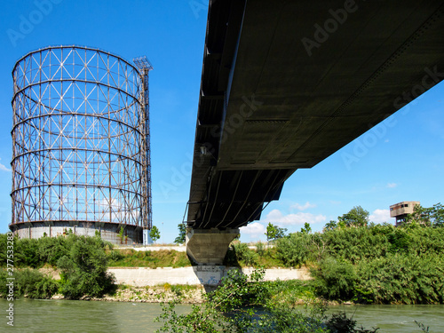 Walking along the Tiber with Gazometro view 2 photo