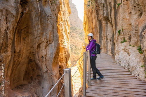 tourist woman in El Caminito del Rey or King's Little Path, one of the most Dangerous Footpath reopened 2015 Malaga, Spain