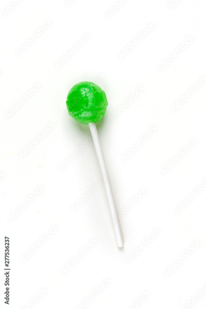 Single colorful candy sucker on a stick Single colorful candy sucker on a stick