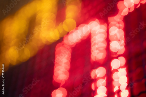 Out-of-focus effect, orange and red LED lights from the scoreboard. Suitable to be a background image.