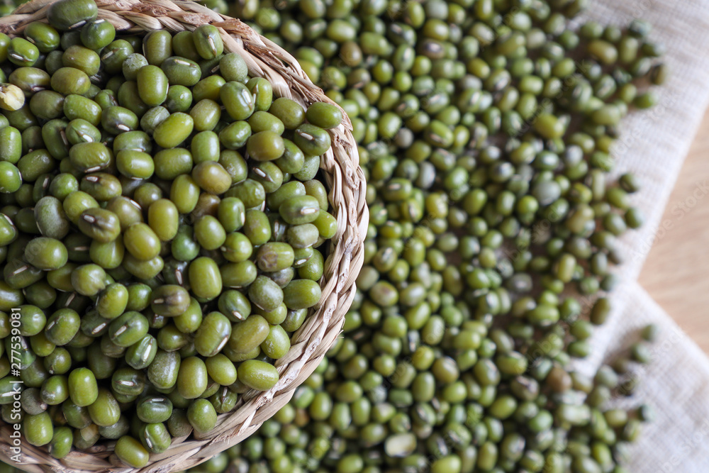 Mung bean seeds have long been used as food for human beings, green beans, seeds that are placed in a white plate, placed on a table with tears and tablecloths.... Mung bean seeds have long been used as food for human beings, green beans, seeds that are placed in a white plate, placed on a table with tears and tablecloths....