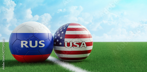 Russia vs. USA Soccer Match - Soccer balls in Russia and USA national colors on a soccer field. Copy space on the right side - 3D Rendering 