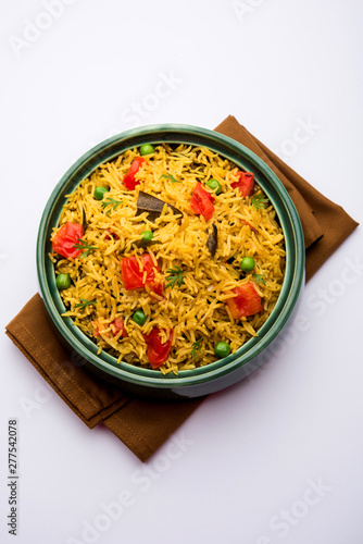 Tomato Rice also known as Tamatar Pilaf/pulav made using basmati rice, served in a bowl. selective focus