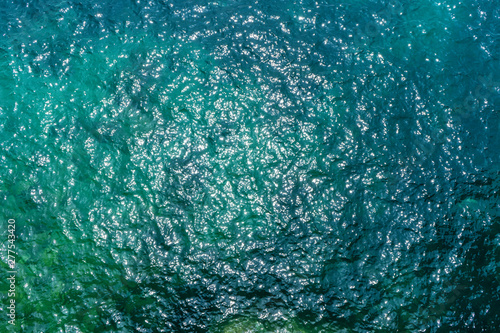Sunny blue sea surface from above