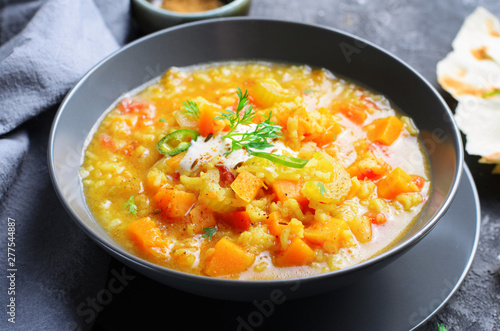 Rice and Pumpkin Indian Soup on Dark Background