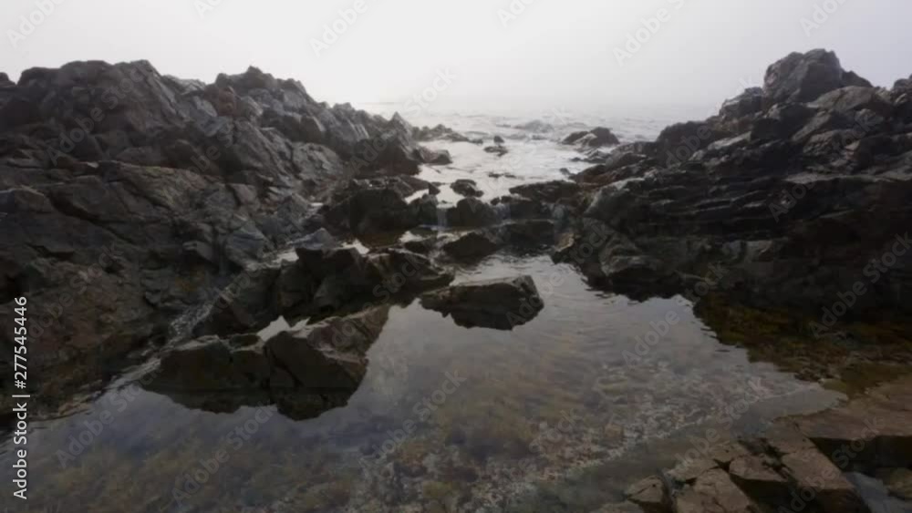 Sea waves roll on the stone during the weather Sea waves roll on the stone during the weather