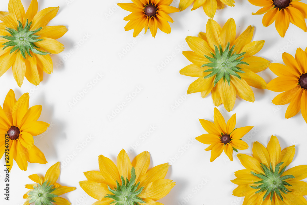 Yellow flowers represented on white background. Many flowers for decorating any post card or celebration card. Summer and autumn concept. Flat lay, top view, copy space Yellow flowers represented on white background. Many flowers for decorating any post card or celebration card. Summer and autumn concept. Flat lay, top view, copy space