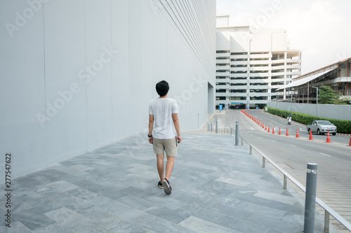 Men walking on the sidewalk Alone