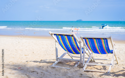 Beach chairs on the white sand beach in summer