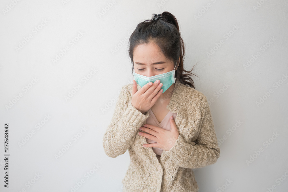Asian women wear health masks to prevent germs and dust. Thoughts about health care Asian women wear health masks to prevent germs and dust. Thoughts about health care