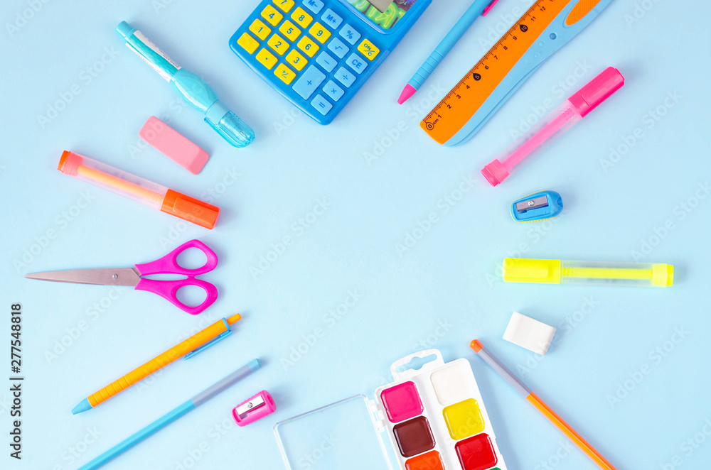 Flat lay from a variety of stationery on a blue background. Flat lay from a variety of stationery on a blue background.