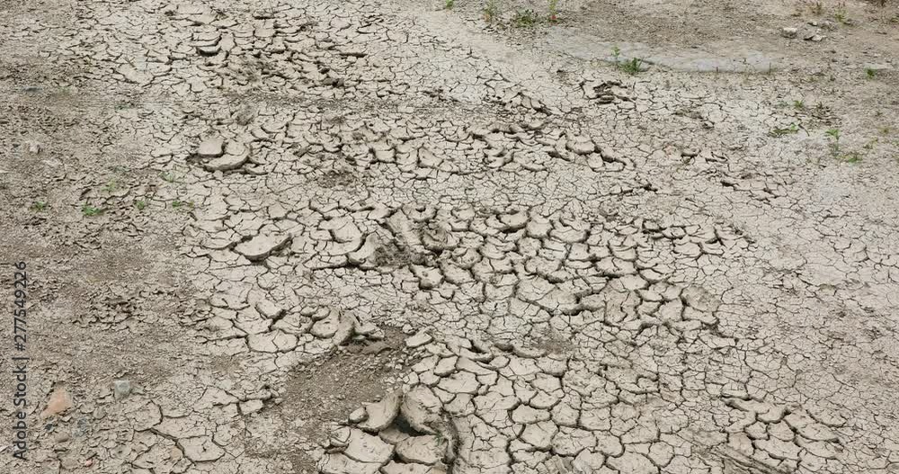 Dry soil crack ground land background, hot dry drought, global warming Dry soil crack ground land background, hot dry drought, global warming