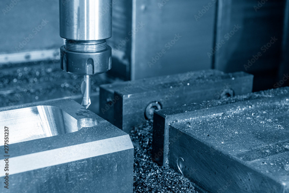 The CNC milling machine drilling the centre drill at the mould parts. The injection mould manufacturing process with the machining centre. The CNC milling machine drilling the centre drill at the mould parts. The injection mould manufacturing process with the machining centre.