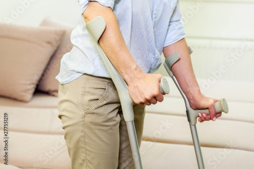 Injured woman on crutches stock photo