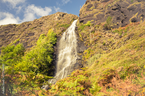 Tiny waterfall on the way to abandoned village Boreraig on the Isle of Skye