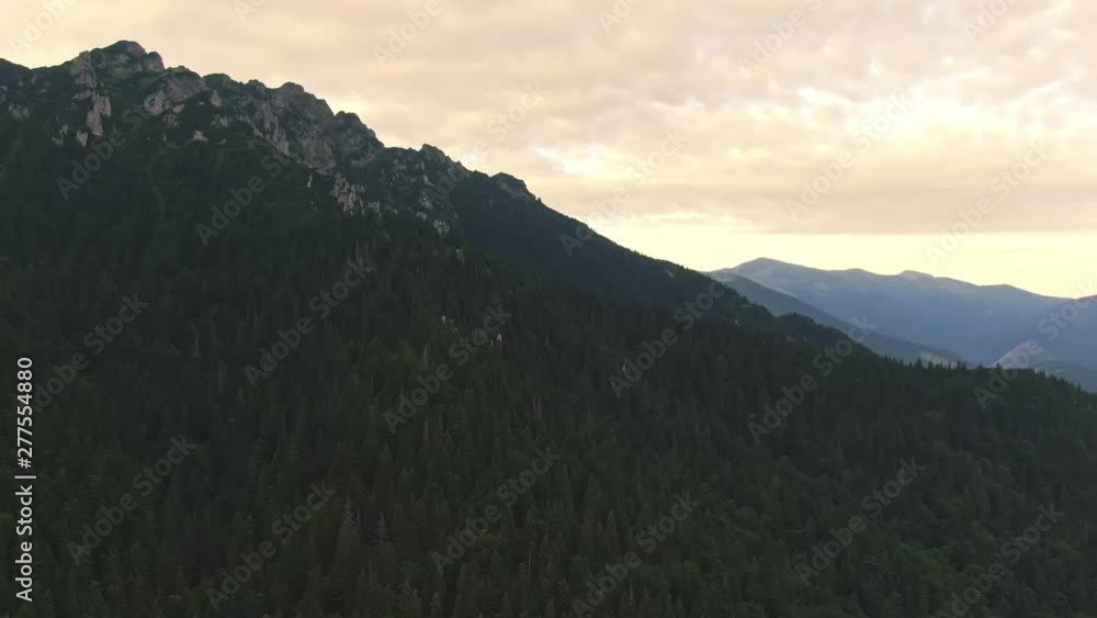 Aerial view of Mala Fatra mountains in Slovakia. Beautiful sunrise scene with look to valley and mountain in tranquil nature. Morning in the fresh forest near the hills. Vibrant colors, soft light. Aerial view of Mala Fatra mountains in Slovakia. Beautiful sunrise scene with look to valley and mountain in tranquil nature. Morning in the fresh forest near the hills. Vibrant colors, soft light.