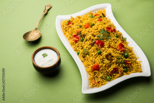 Tomato  pulav/Pilaf made using basmati rice, served in a bowl. selective focus